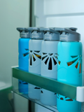 Set of borosilicate glass water bottles in fridge