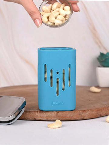 A borosilicate glass kitchen container with silicone sleeve